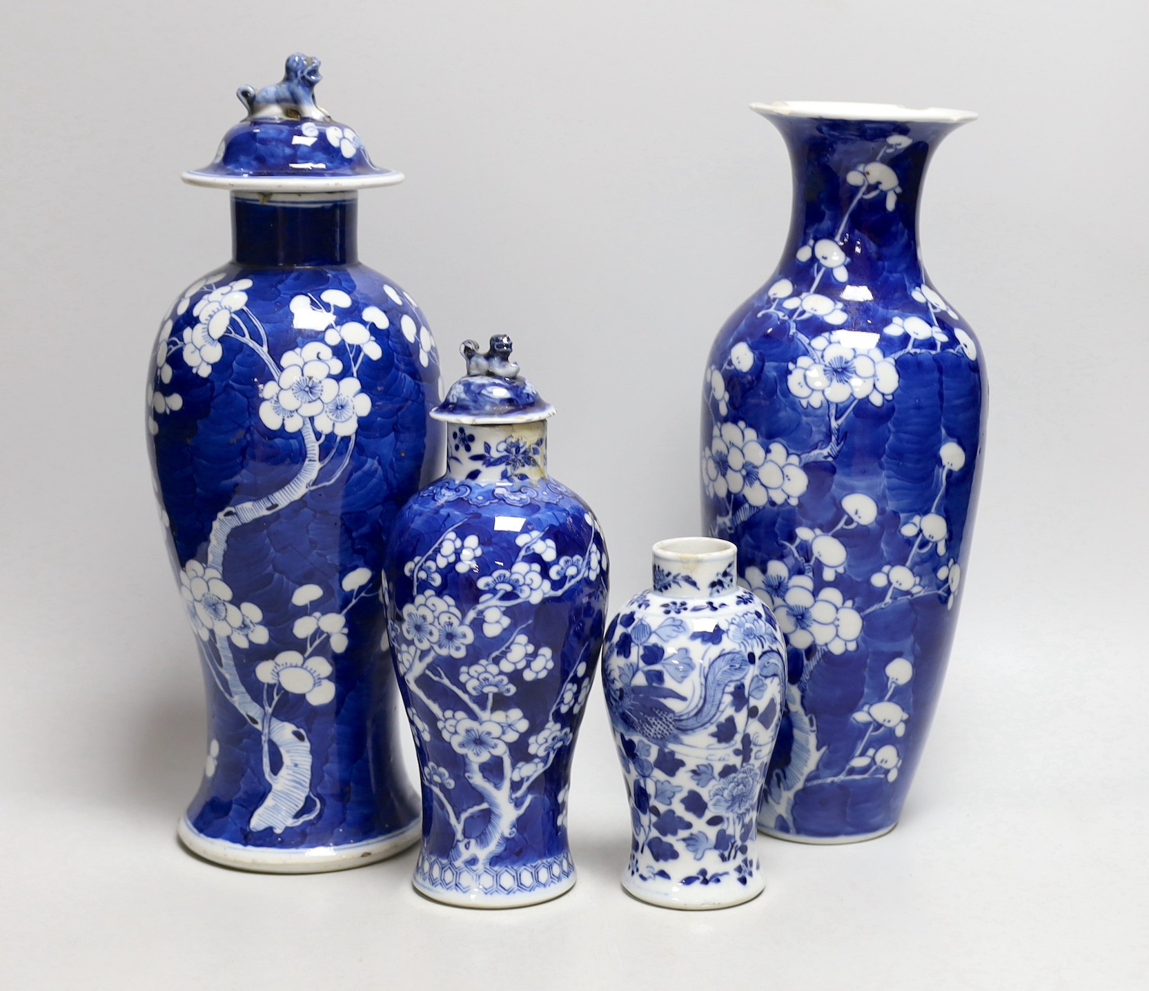 A Chinese prunus baluster jar and cover and three others, similar, tallest 30cms high